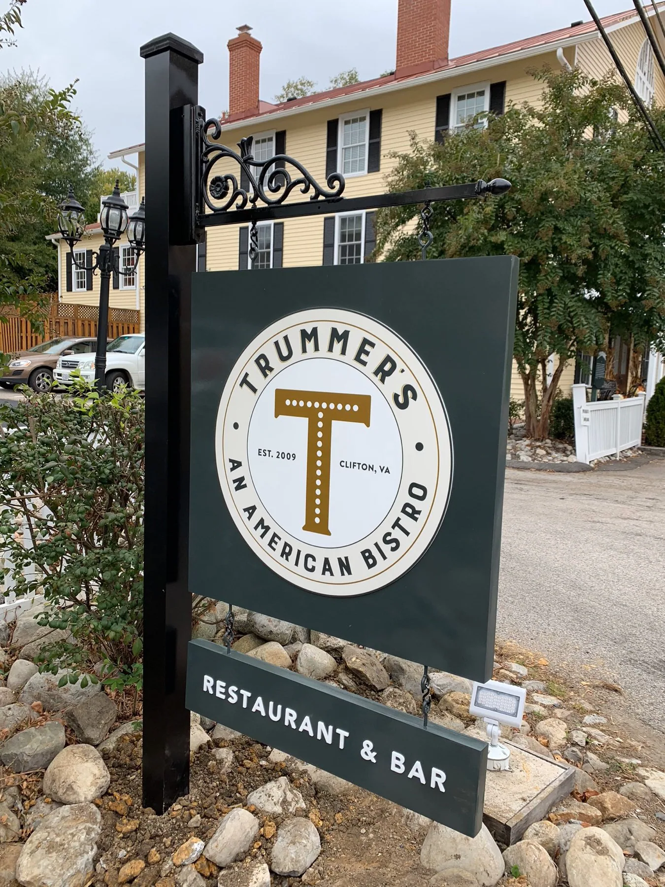 Trummer's Coffee and Wine Bar hanging sign in Clifton, Virginia